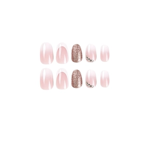Short oval press-on nails with pink ombre, white French tips, rose gold glitter, and rhinestones