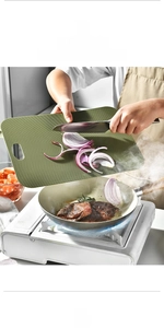 Flexible green thin cutting board with non-slip texture for meat and vegetable prep