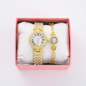 Detail of gold quartz watch with Roman numerals and matching crystal bracelet set