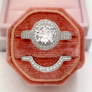 Silver-tone micro-pave zircon wedding ring set with round main stone in pink velvet box