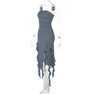 Detail of grey-blue bodycon dress with ruched fabric and asymmetric ruffled hemline