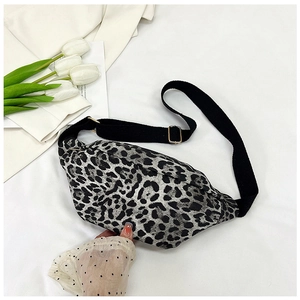 Detail of leopard print crossbody bag with adjustable black strap and metal buckle