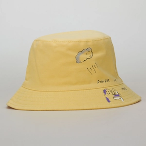 Detail of yellow cotton bucket hat with Power of Love graffiti and hand-drawn art print