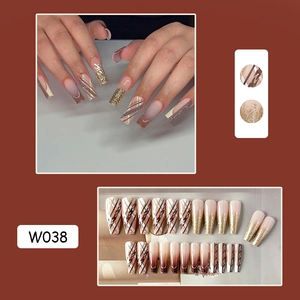 Detail view of coffee brown trapezoid press-on nails with gold glitter, model W038