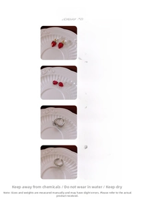 Detail showing red strawberry jewelry set with copper, faux pearls and cubic zirconia