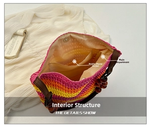 Detail view of rainbow straw bag interior showing lining, pocket, and magnetic closure