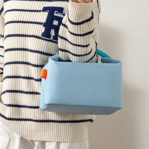Portable light blue insulated lunch bag made of oxford fabric with orange strap accents