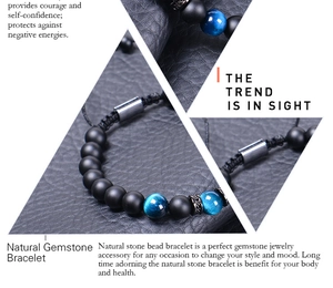 Detail of natural matte agate and blue tiger eye stone beads on black woven bracelet