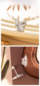 Macro detail of silver titanium steel ear stud featuring marquise zircon petals design