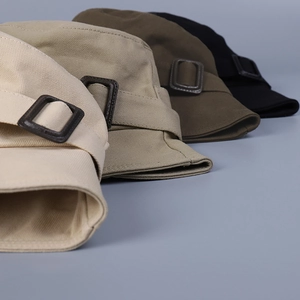 Flat top bucket hats in four colors featuring side decorative leather buckle straps