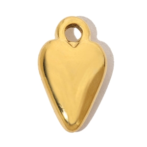 Macro detail of a golden heart-shaped stainless steel pendant with a shiny polished finish