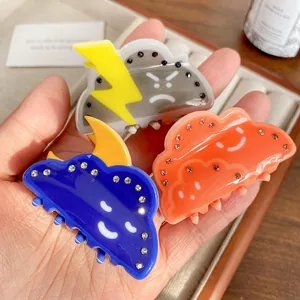 Set of three cute cloud acrylic hair claws with rhinestones and funny expressions