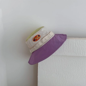 Detail of kids quick-dry sun hat showing tricolor patchwork and YIJIA 1017 patch