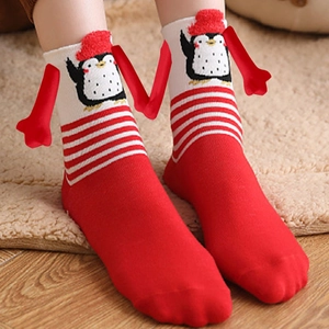 Christmas magnetic holding hands socks featuring cute 3D cartoon penguin and red holiday patterns
