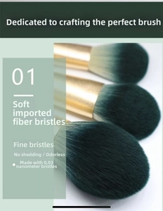Detailed macro view of 0.03nm soft fiber bristles with green gradient and gold metal ferrule