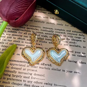 French vintage style earrings with golden hollow flower and large heart pearl pendants