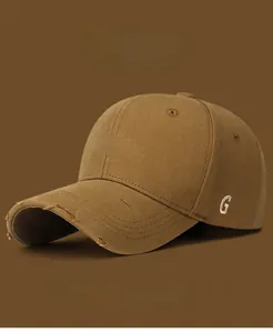 Close-up of distressed brim with November Time 3D embroidery on caramel baseball cap