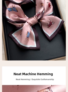 Exquisite close-up showing neat machine-stitched edges on pink horse silk scarf