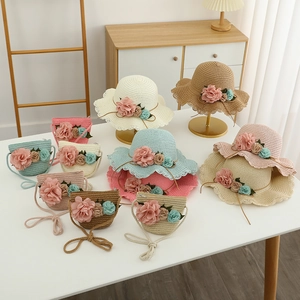 Girl's woven sun hat and matching flower purse set with elegant wavy brim for summer