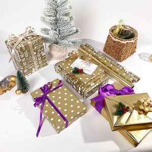 Gold Christmas wrapping paper set with white polka dots, festive ribbons and gift tags