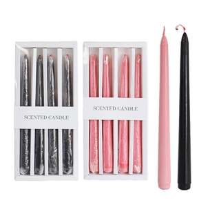 Detail of pink and black bleeding taper candles in elegant boxed sets for Halloween