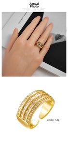 Detailed view of 5.5g gold plated adjustable ring with triple row cubic zirconia setting