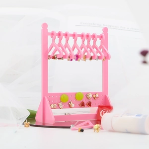 Pink acrylic jewelry organizer in mini clothes hanger shape for earrings and necklaces