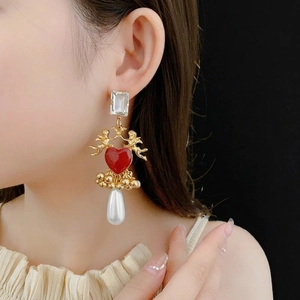 Vintage angel heart drop earrings with gold cherubs and white teardrop pearls on model