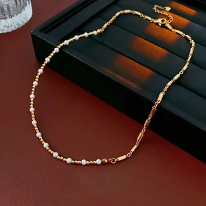 Elegant gold bead and pearl necklace for women featuring a stylish clasp and luxury finish
