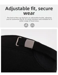 Detail of adjustable metal buckle on black winter cap for size adjustment and secure fit