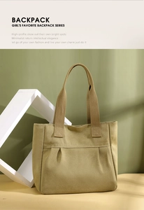 Detail shot of khaki canvas tote bag featuring pleated design and reinforced handles
