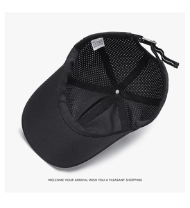 Detailed internal view of black mesh baseball cap showing breathable texture and wash label