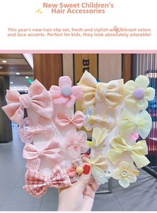 Detailed set of colorful mesh lace bow hair clips and flower hairpins for kids