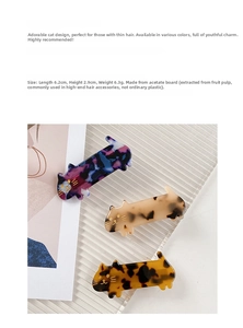 Detailed view of three-piece acetate cat-shaped hair clips in various marble textures