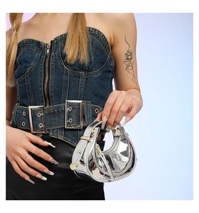 Silver Y2K metallic mirror handbag with crescent shape and stylish metal buckle detail