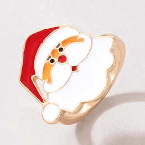Macro detail of Santa Claus enamel ring with festive red and white oil drop finish