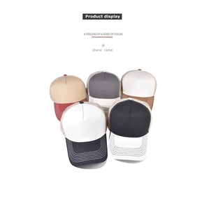 Detail view of five multi-color trucker hats with breathable mesh and cotton construction