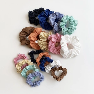 Colorful fabric oversized scrunchies set in assorted pastel and neutral tones