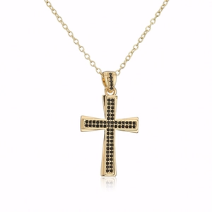 Detailed macro view of 18K gold plated cross pendant with pavé set black zircon stones