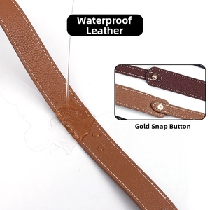 Detail of waterproof lychee textured leather bag strap with gold metal stud closure
