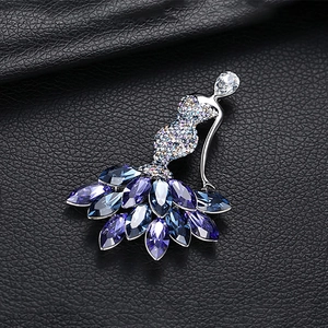 Elegant crystal mermaid dancer brooch with blue and purple stones on black leather