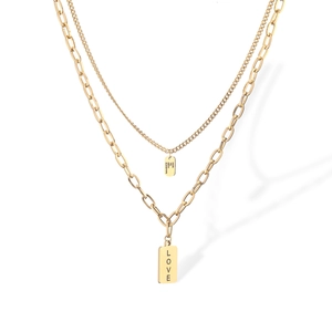Detail of golden double layer necklace with engraved square LOVE tags on white backdrop