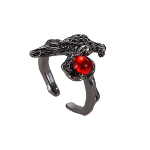 Gothic raven skull ring with a red bead in black metal finish, adjustable open band style