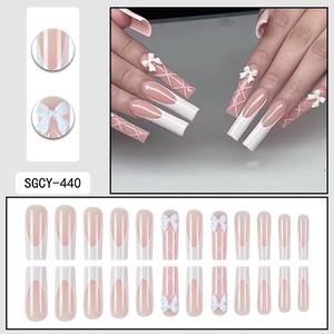 White French tip press-on nails with pink bow and ribbon ballet core design