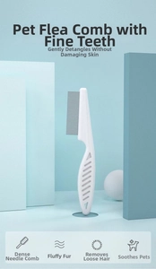 Detail of white pet flea comb with fine steel teeth and non-slip plastic handle grip