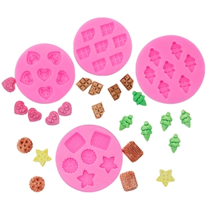 Pink silicone mold set for DIY chocolate and ice cream charms with heart and bow designs