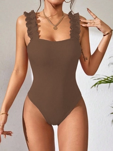 Detailed texture of brown ribbed bodysuit with ruffled straps and a square neckline