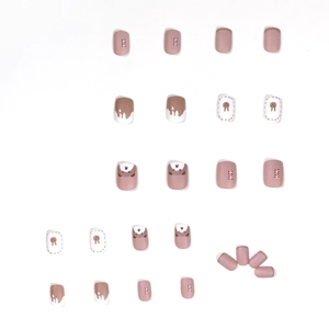Cute brown and pink bear press-on nails with cartoon patterns and polka dot design
