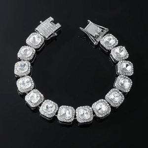 Macro shot of silver hip-hop cuban bracelet with square rhinestones and lobster clasp