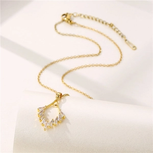 Minimalist gold necklace featuring fan-shaped zircon pendant and slender O-chain link